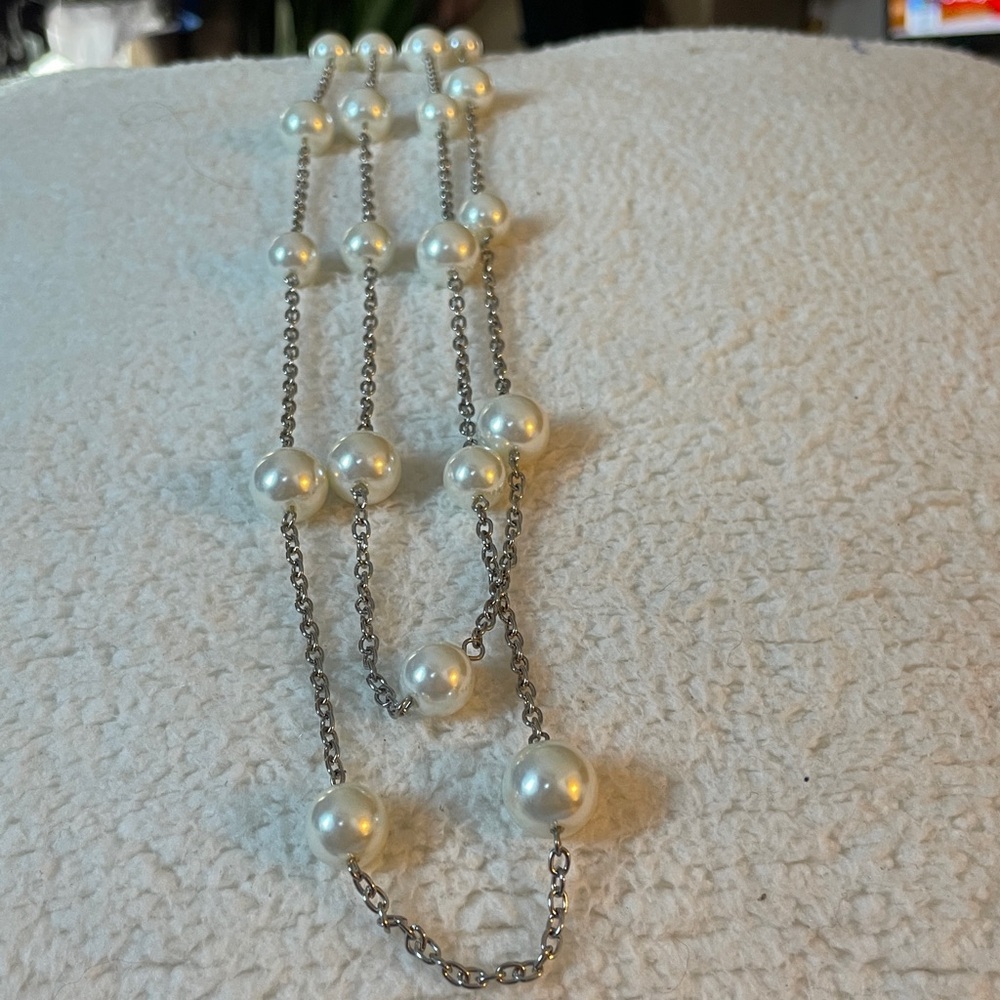 faux pearls on a gold tone chain